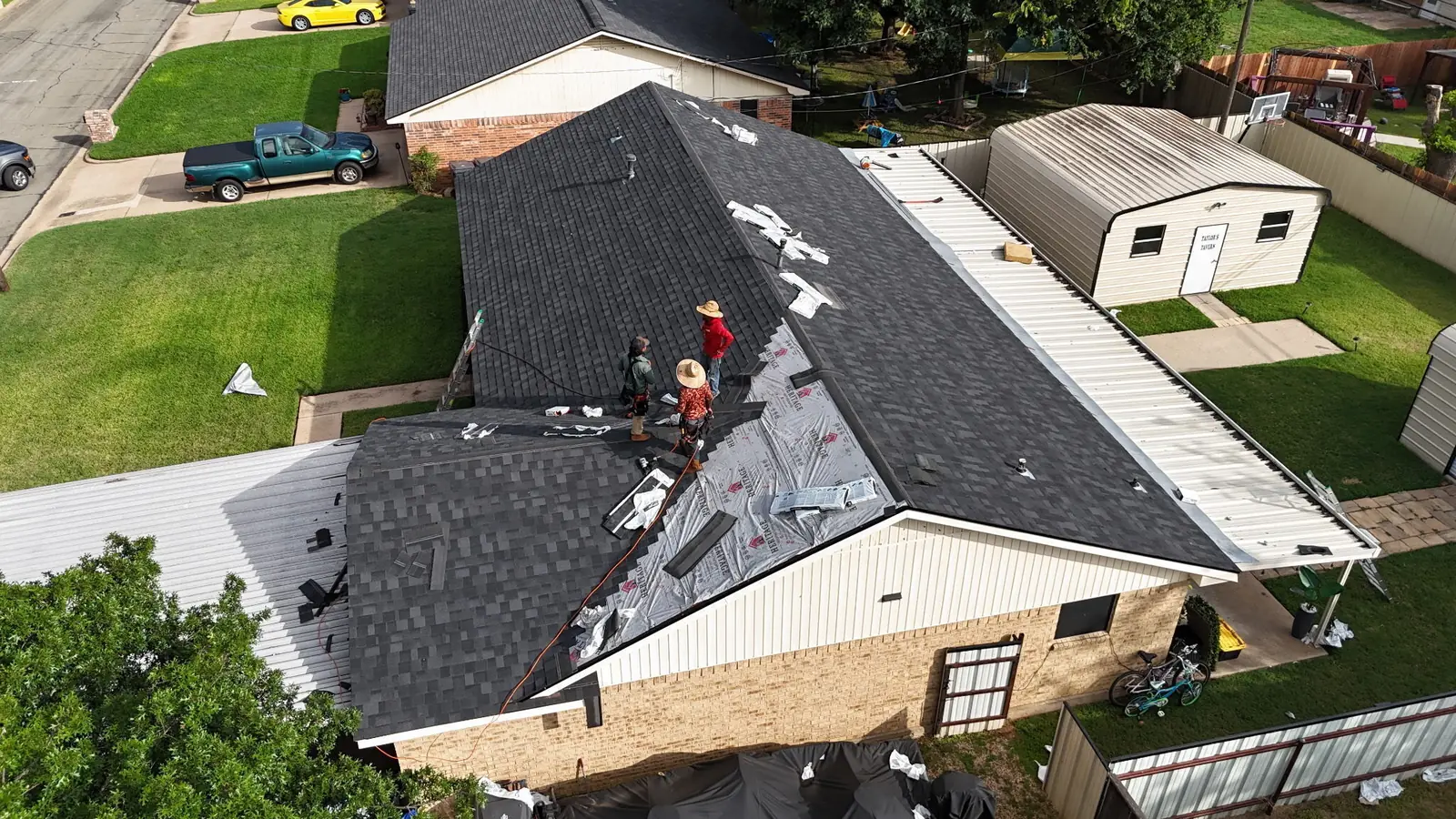 The ACS crew working on a roof in Waco, seen from above