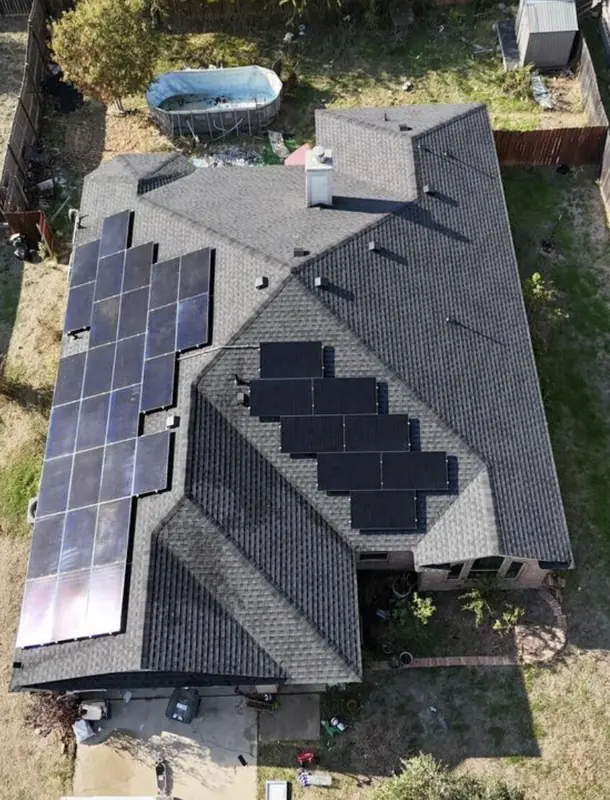 A large solar array on a shingle roof, from above