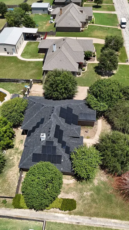 Solar panels on a finished shingle roof, from above